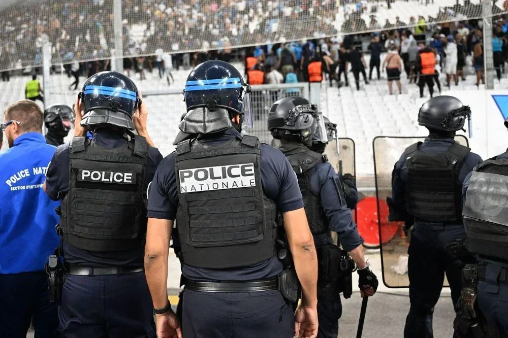 CRS police officers watch on during a Marseille match in the Uefa Champions League