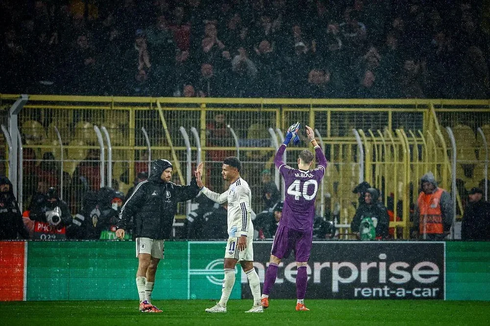 Aston Villa players celebrate in front of the away end after beating Fenerbahce 1-0 in the Uefa Europa League in Istanbul